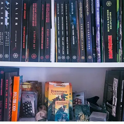 A shelf of RPG books from small and independent publishers